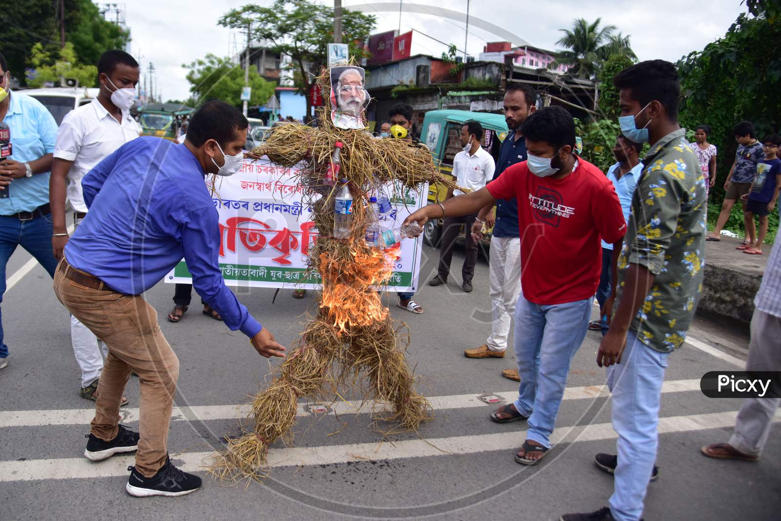 Asom Jatiyatabadi Yuba Chatra Parishad (AJYCP) activists burn effigies of Prime Minister Narendra Modi  during a  a protest against recent  farm bills  in Nagaon District of Assam on Sep 23,2020