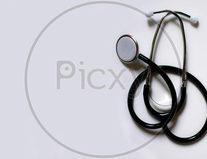 Modern black stethoscope isolated on white background