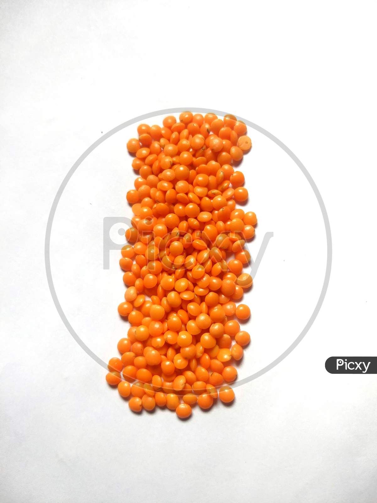 Red lentils or Masoor dal in white background