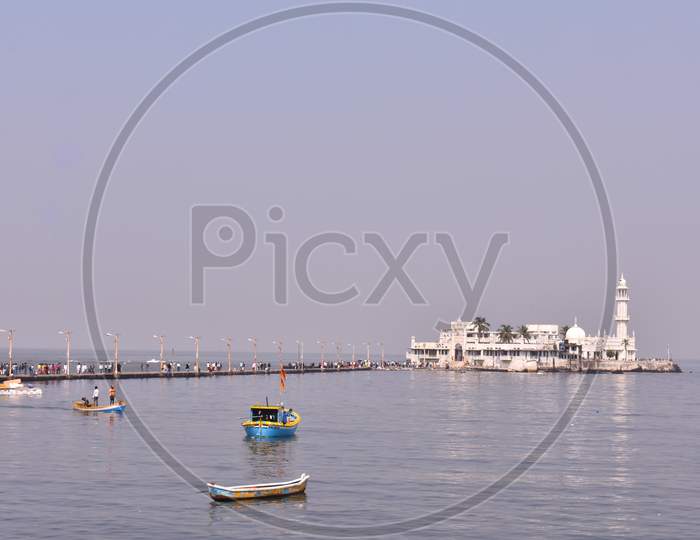 Small Boats Floating Near Haji Ali Dargah In Mumbai