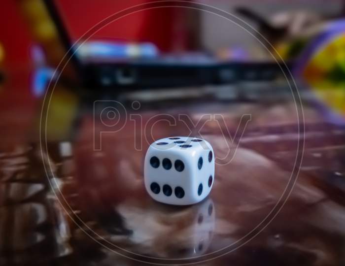 Close up shot of a dice on the table