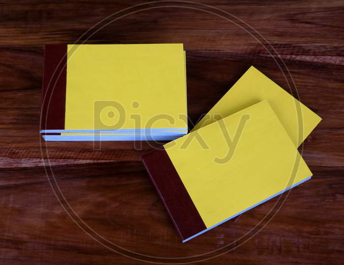 Yellow Color Bill Books Or Receipt Books On A Wooden Surface