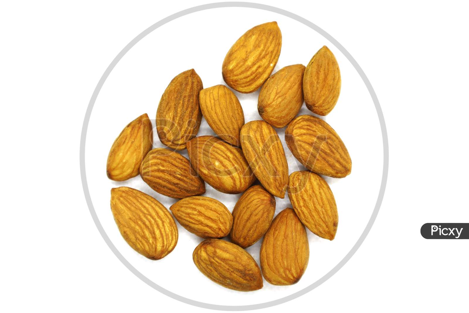 Pile Of Almonds, Top View. White Isolated Background.Depth Of Field.