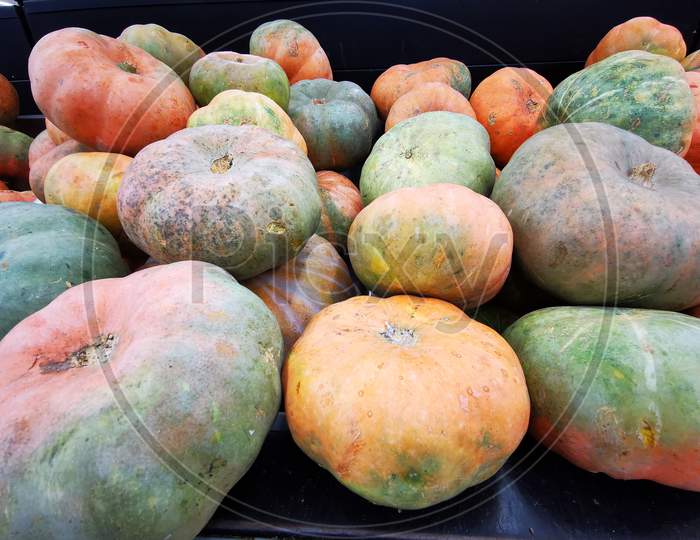 A pumpkin is a cultivar of winter squash that is round with smooth, slightly ribbed skin, and most often deep yellow to orange in coloration. The thick shell contains the seeds and pulp
