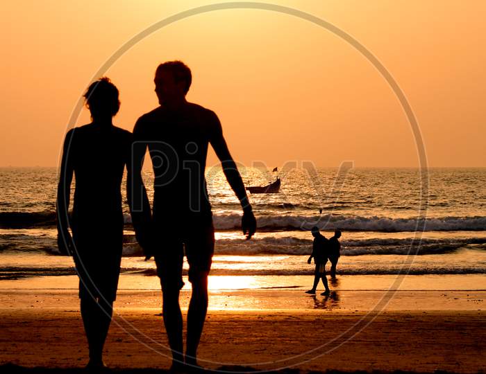 Couples Roaming at beach of India at Sunset