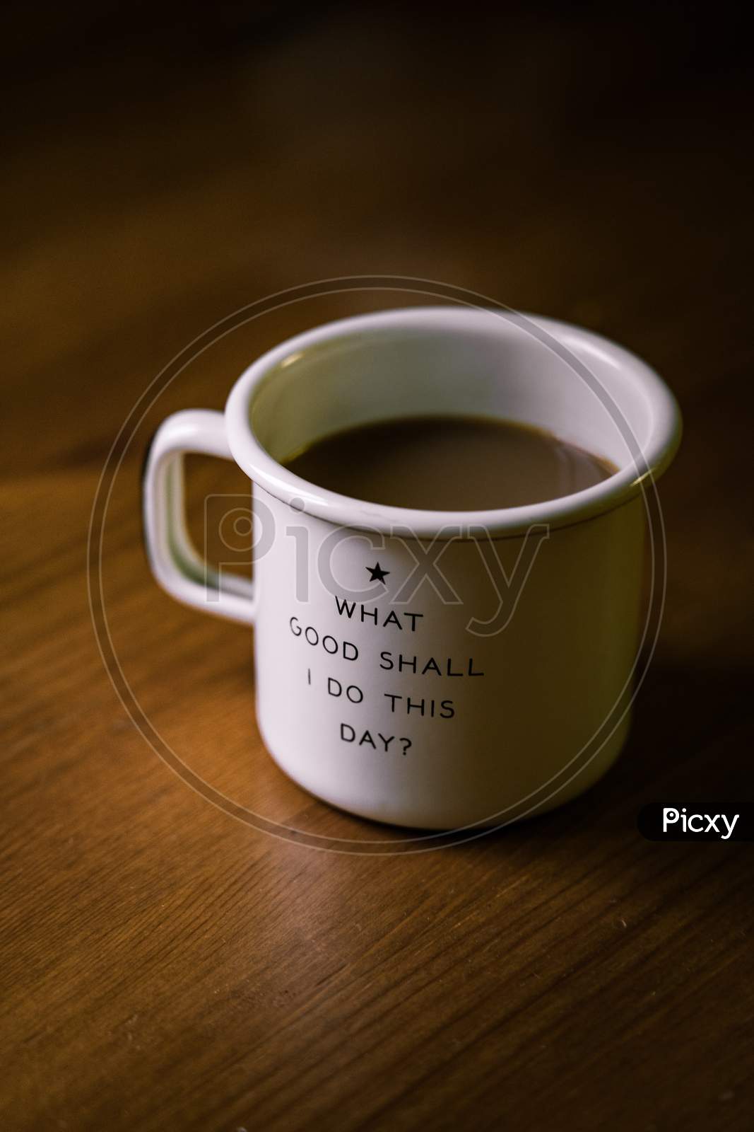 White Coffee Mug With Motivational Quote " WHAT GOOD SHALL  I DO  THIS DAY? " In The Coffee Mug With Coffee In It.