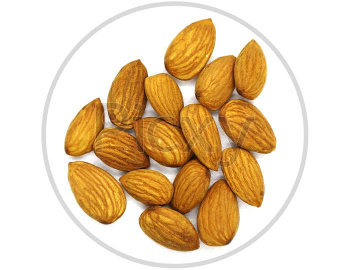 Pile Of Almonds, Top View. White Isolated Background.Depth Of Field.