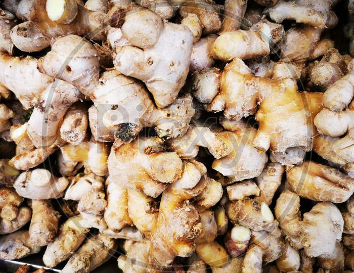 Ginger is a flowering plant whose rhizome, ginger root or ginger, is widely used as a spice and a folk medicine. It is a herbaceous perennial which grows annual pseudostems about one meter tall bearing narrow leaf blades