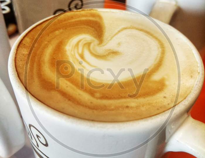 Coffe mug and cappuccino