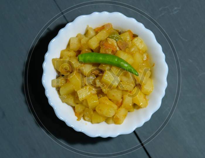 Indian Bengali Food Puri Or Luchi With Aloo Sabji (Potato Vegetable Dish). Indian Poori Is A Bread Deep Fried In Refined Oil. It Is A Traditional Bengali Breakfast Dish