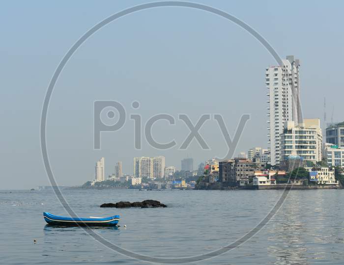 Mumbai Sea With Beautiful Tall Buildings Near The Shore