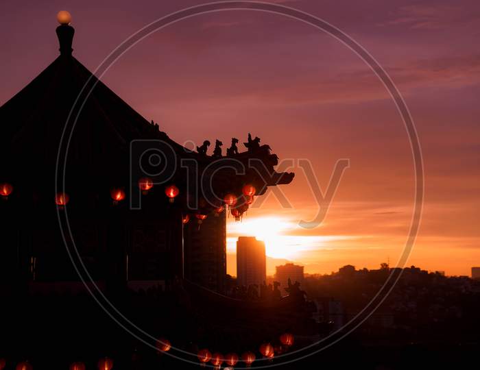 Chinese pagoda in silhouette at sunset