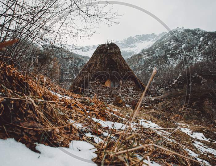 Cabin In The Middle Of The Snowy Mountains During Winter In Asturias With A Rural View And Trekking Refuge