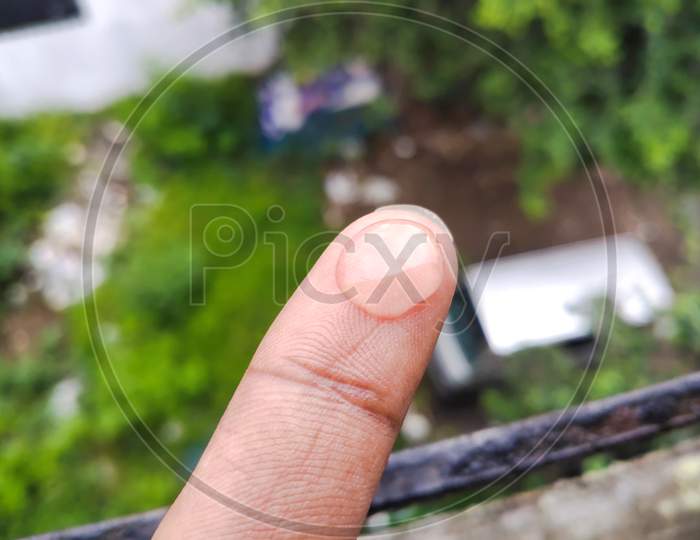 Water drop in finger tip