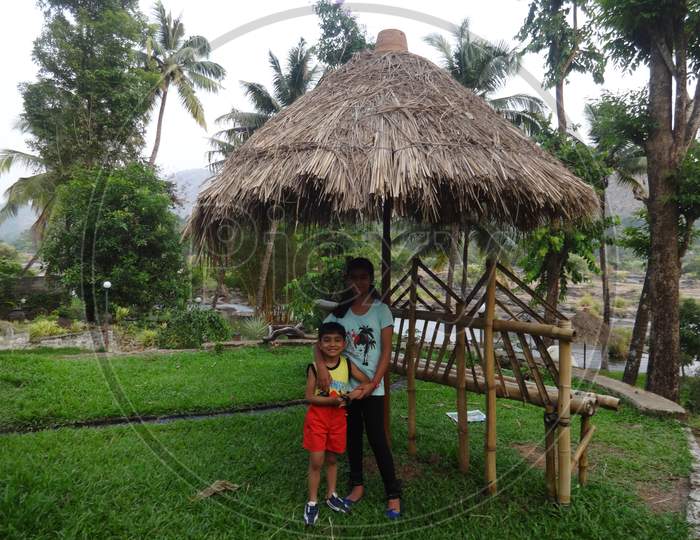 children posing inside a resort in Kerala
