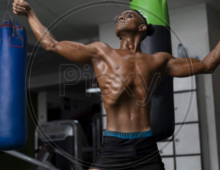 Bodybuilder Posing. Beautiful Sporty Guy Male Power. Fitness Muscled Man