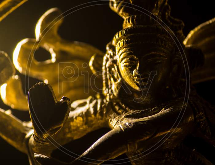 Close Up Of The Golden Iolo Of A Hindu God