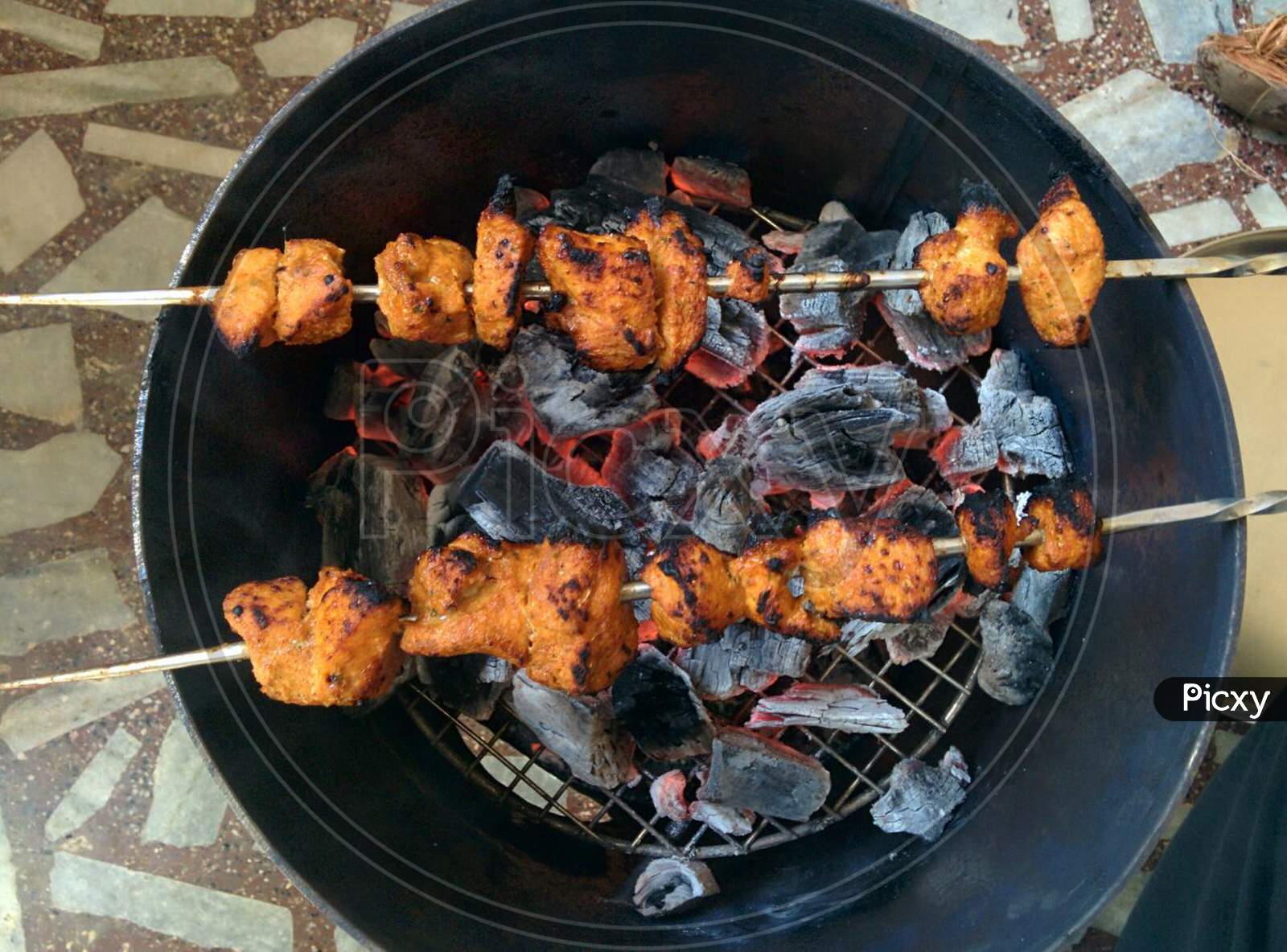 Chicken Kebab In Home Made Tandoori Stove.