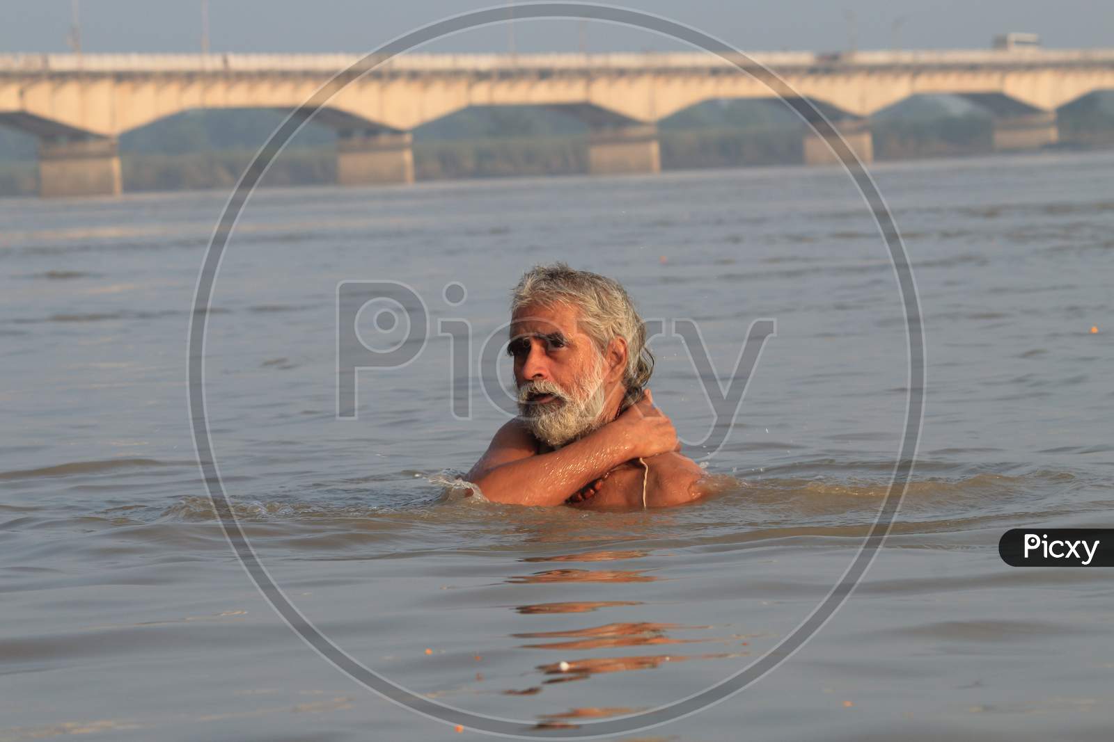 SADHU IN SARYU RIVER BATHING AYODHYA UTTAR PRADESH INDIA