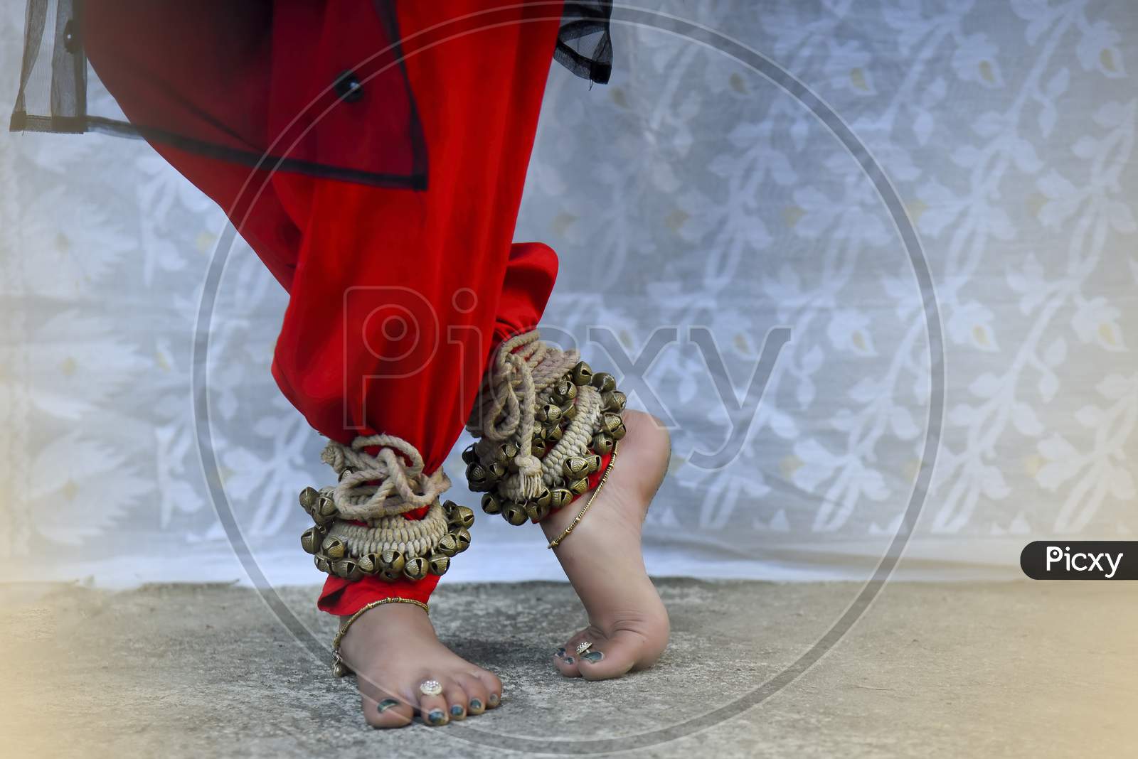 dance form indian classical feet with ghungru.Kathak Girl tying ghungaroo.