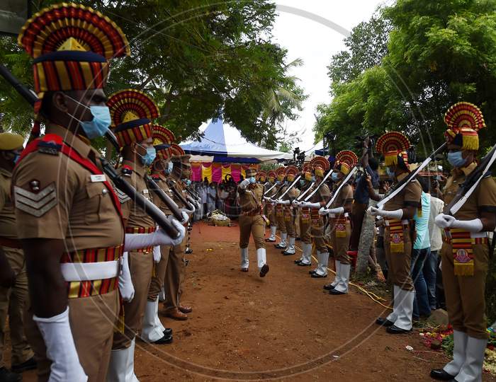Tamil Nadu Police Personnel Pay Gun Salute Near The Mortal Remains Of Legendary Playback Singer Sp Balasubrahmanyam During His Funeral Ceremony, At His Farmhouse In Thamaraipakkam Village Of Thiruvallur District, Saturday