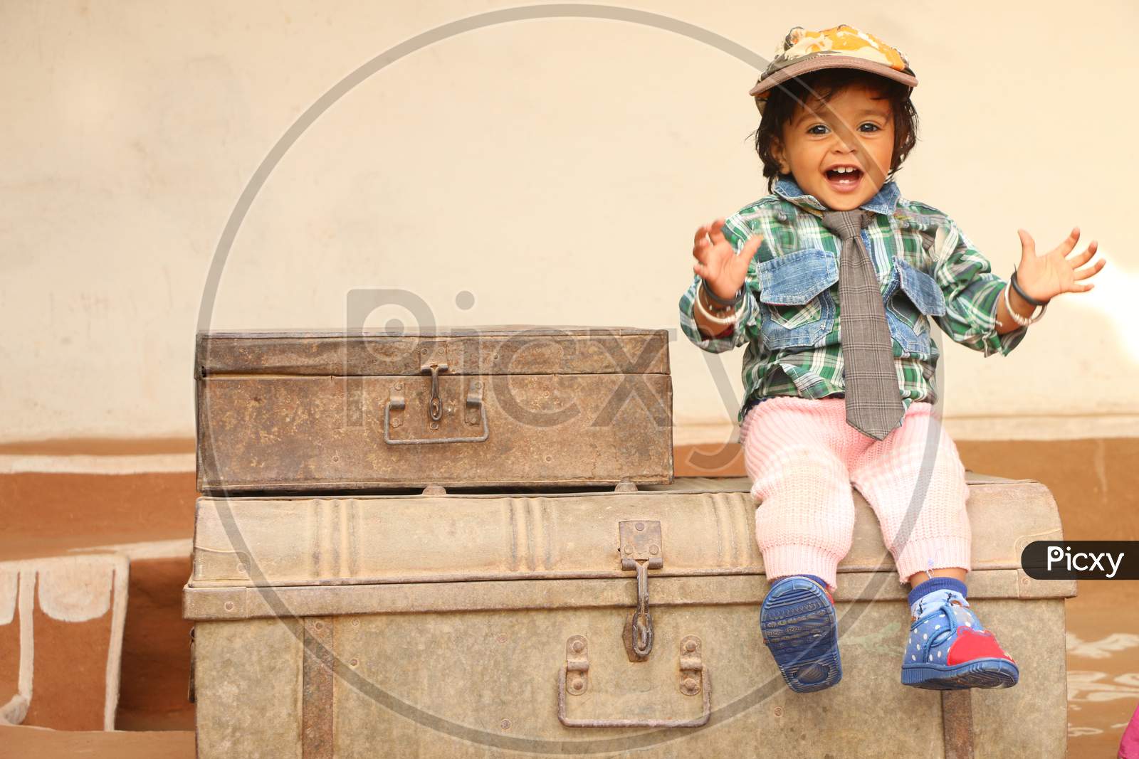2 Year Old Beautiful Girl Wearing Cap Tie And Boy Dress, 2 Year Old Beautiful Girl Sitting On Iron Box,