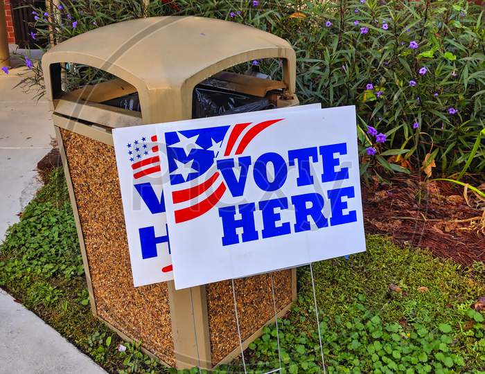 Garbage can Ballot Box with vote here sign
