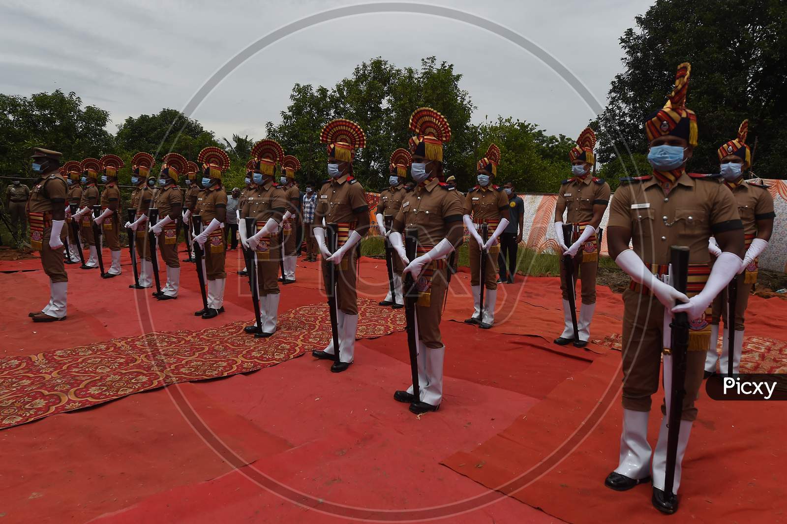 Tamil Nadu Police Personnel Pay Gun Salute Near The Mortal Remains Of Legendary Playback Singer Sp Balasubrahmanyam During His Funeral Ceremony, At His Farmhouse In Thamaraipakkam Village Of Thiruvallur District, Saturday
