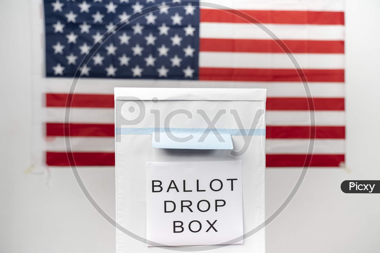Concept Of Mail In Vote At Us Election -Ballot Box With Us Flag As Background.