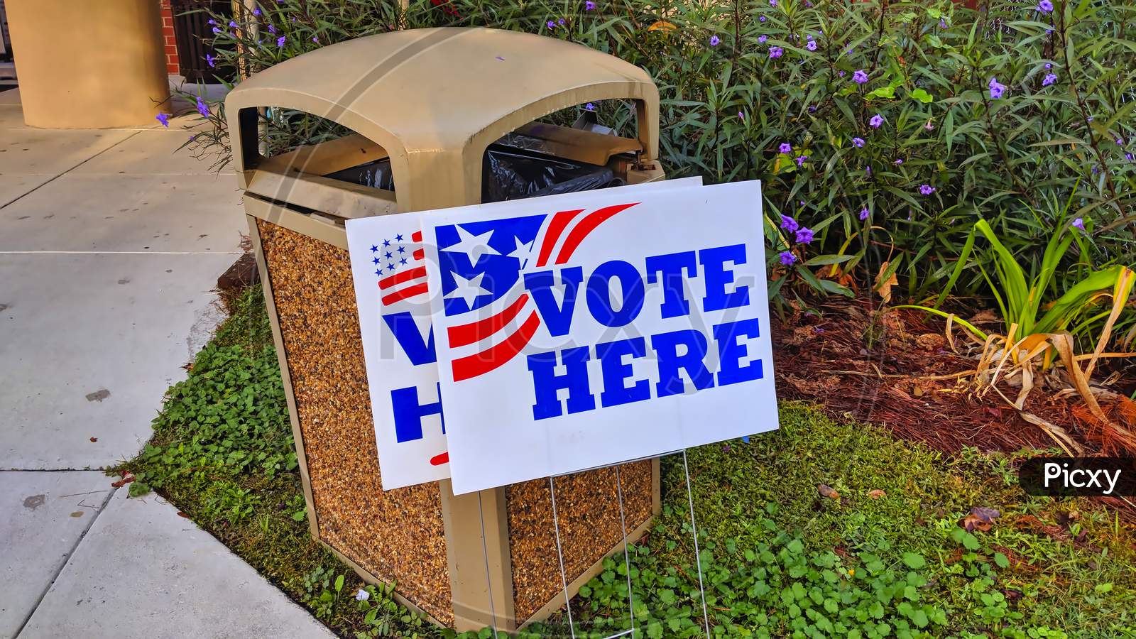 Garbage can Ballot Box with vote here sign