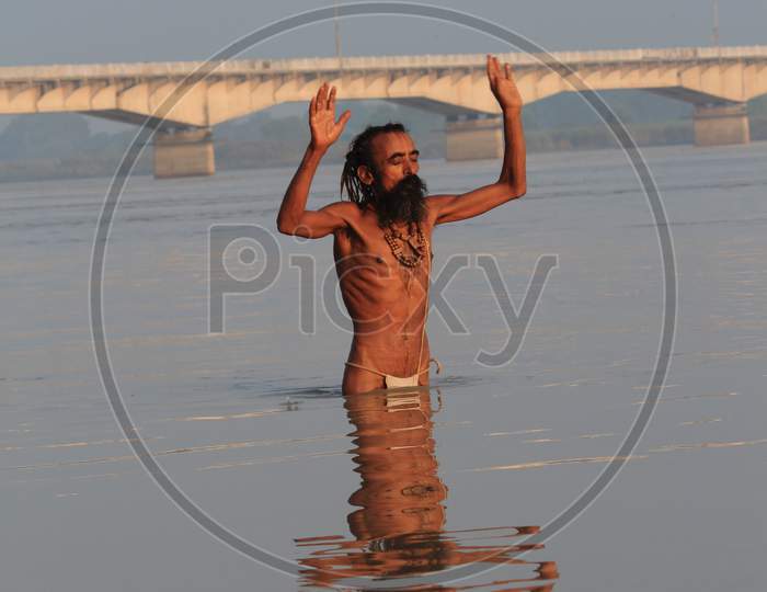 SADHU IN SARYU RIVER BATHING AYODHYA UTTAR PRADESH INDIA