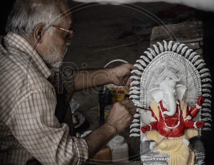 Artisan painting Ganesha