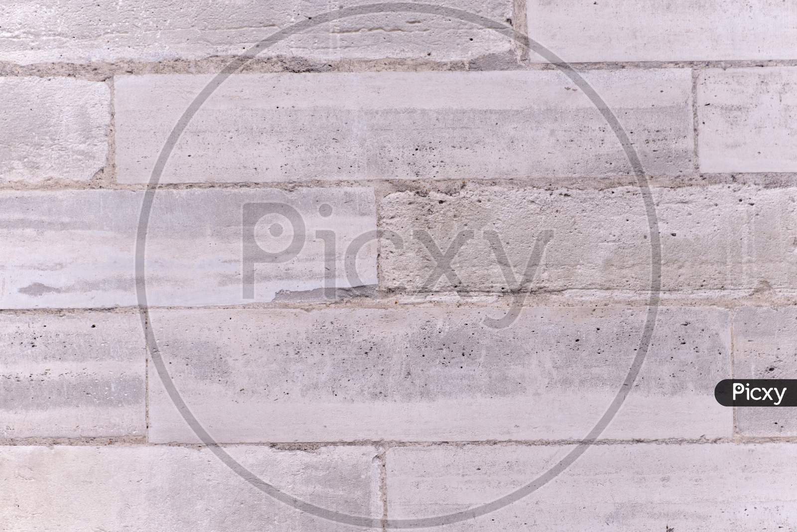 An Image Of A Bricked Wall Divided By Cemented Texture