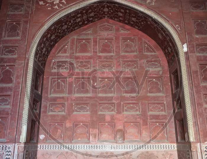 Taj Mahal. Detail Of Red Sandstone Doorway In Perimeter Wall Surrounding Landscaped Gardens