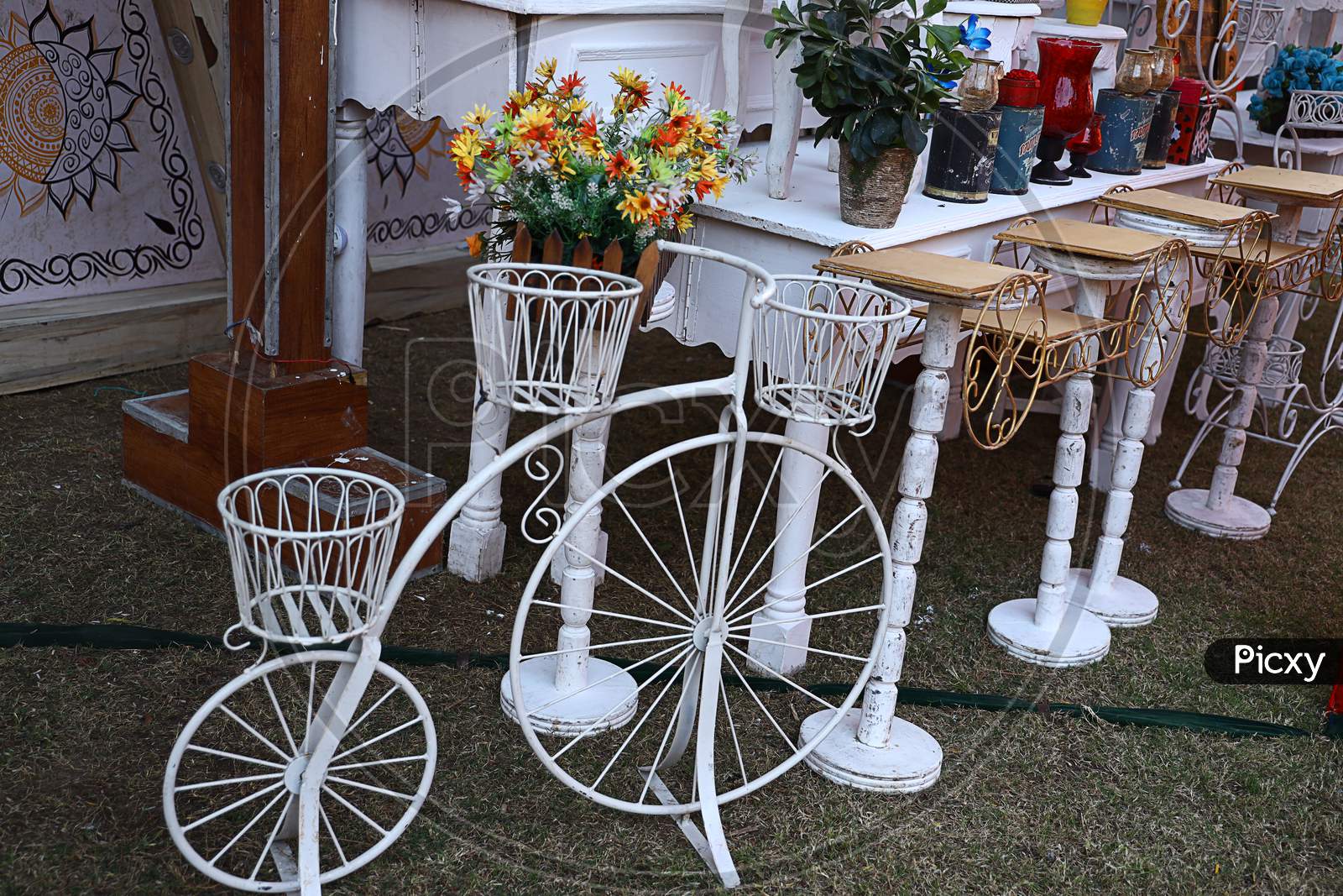 Decorative Vintage Old Model Bicycle With Vases For Flowers On A Grassland, Outdoor Decorated Background, Wedding Event Decor Concept