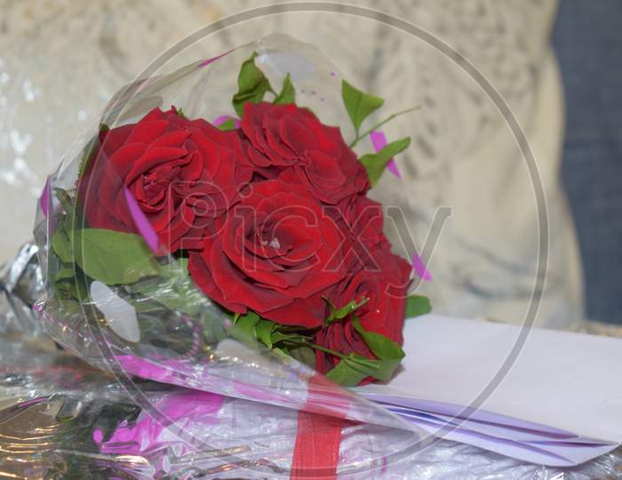 Rose Bouquet With A Letter Of Best Wishes