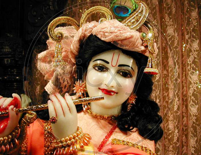 lord krishna playing flute