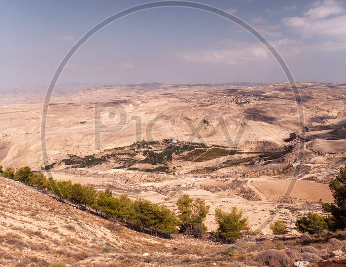 View From Top Of The Mount Nebo To The Jordanian Desert Valley. Desert Land Around The Dead Sea.