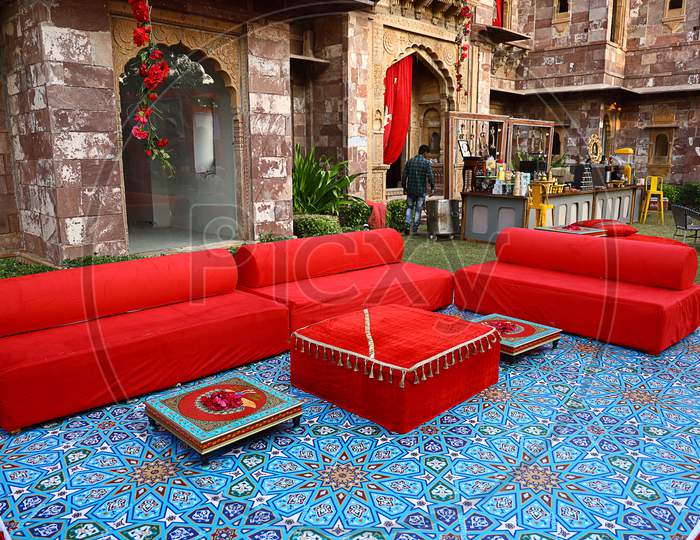 Jodhpur, Rajasthan, India, August 20Th, 2020: Luxury Wedding Destination With Red Couch Or Sofas For Guests For Wedding Or Reception Ceremony In Backyard Or Lawn, Wedding Event Decor Concept
