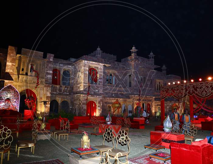 Night Time Shot Of Decorated Luxury Indian Palace Backyard Lawn For Wedding Or Reception Ceremony, Wedding Event Decor Concept, Night Time Exposure