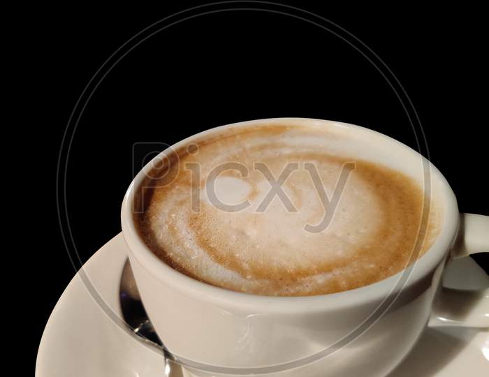 A Cup Of Coffee With Black Background.