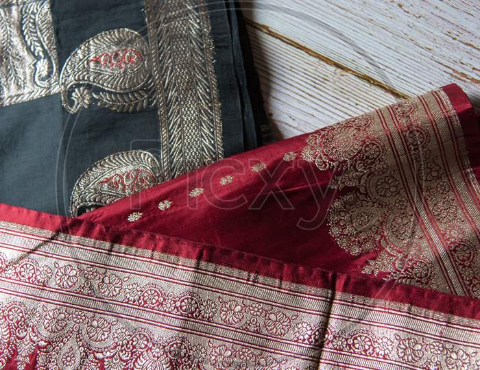 Black and red sari on a background