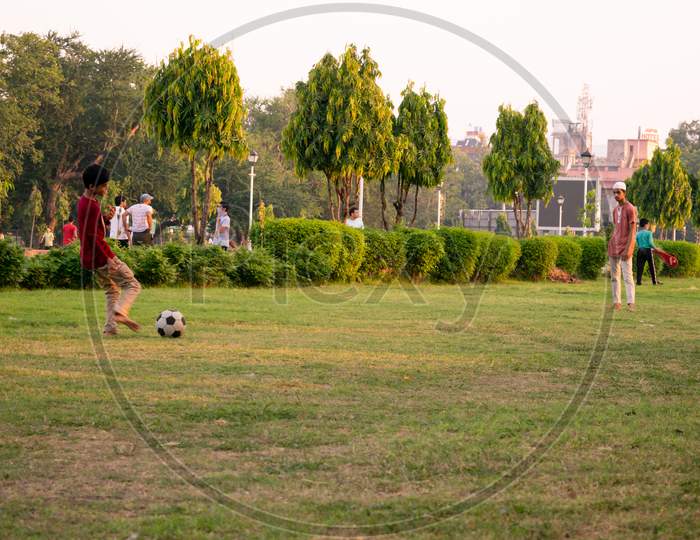 Football players playing football at a playground, Jaipur