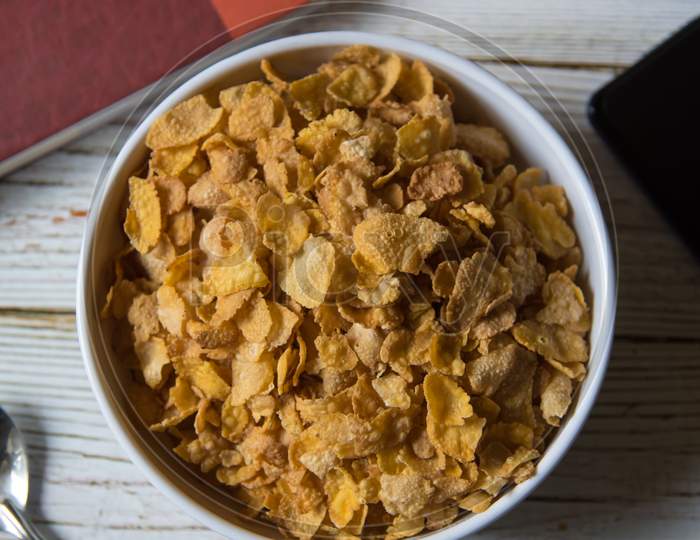 Close up view from top of a bowl of corn flakes