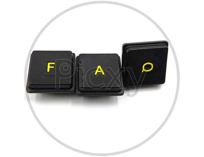 Alphabet blocks over a white surface forming the word faq