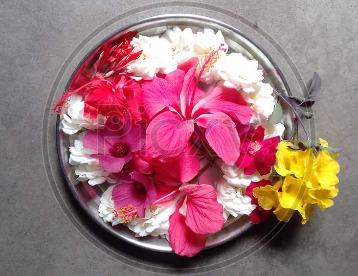 conglomeration of different flowers in a plate