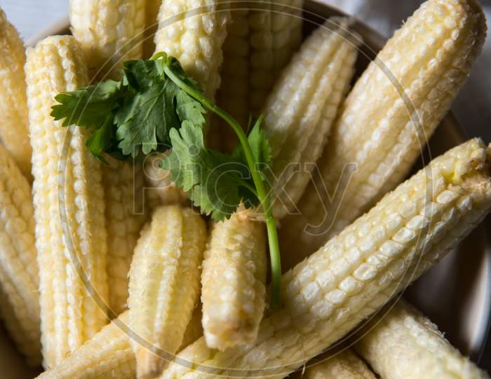 Close up of fresh baby corns in a heap