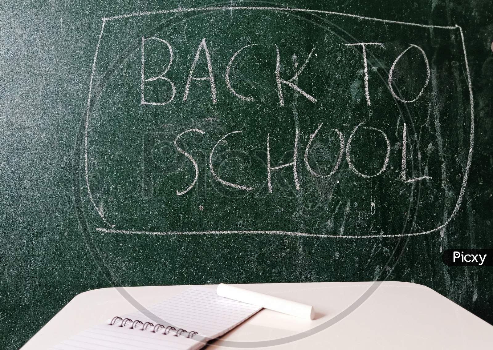 Back to School written on a chalkboard.
