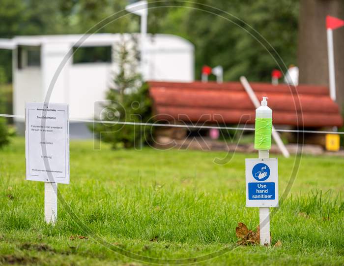 Hand Sanitiser And Covid 19 Return To Sport Sign At An Outdoor Horse Trials Event