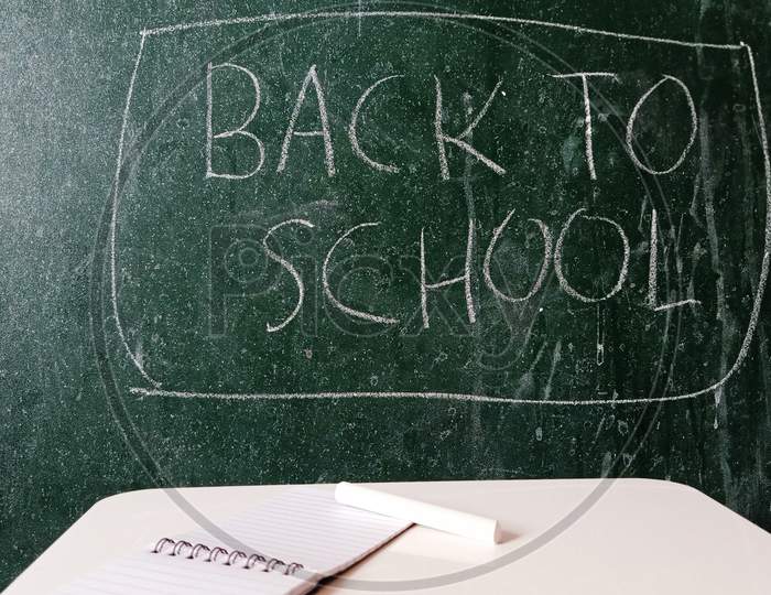 Back to School written on a chalkboard.